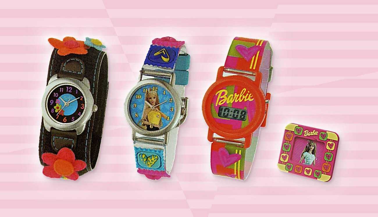 Four pieces from the Barbie line on pink stripes: a black felt-flower watch, a heart patches watch, an orange digital watch and a mini photo frame