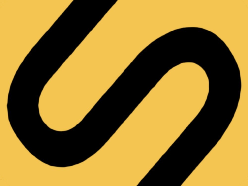 The gold Soleus S emblem on black