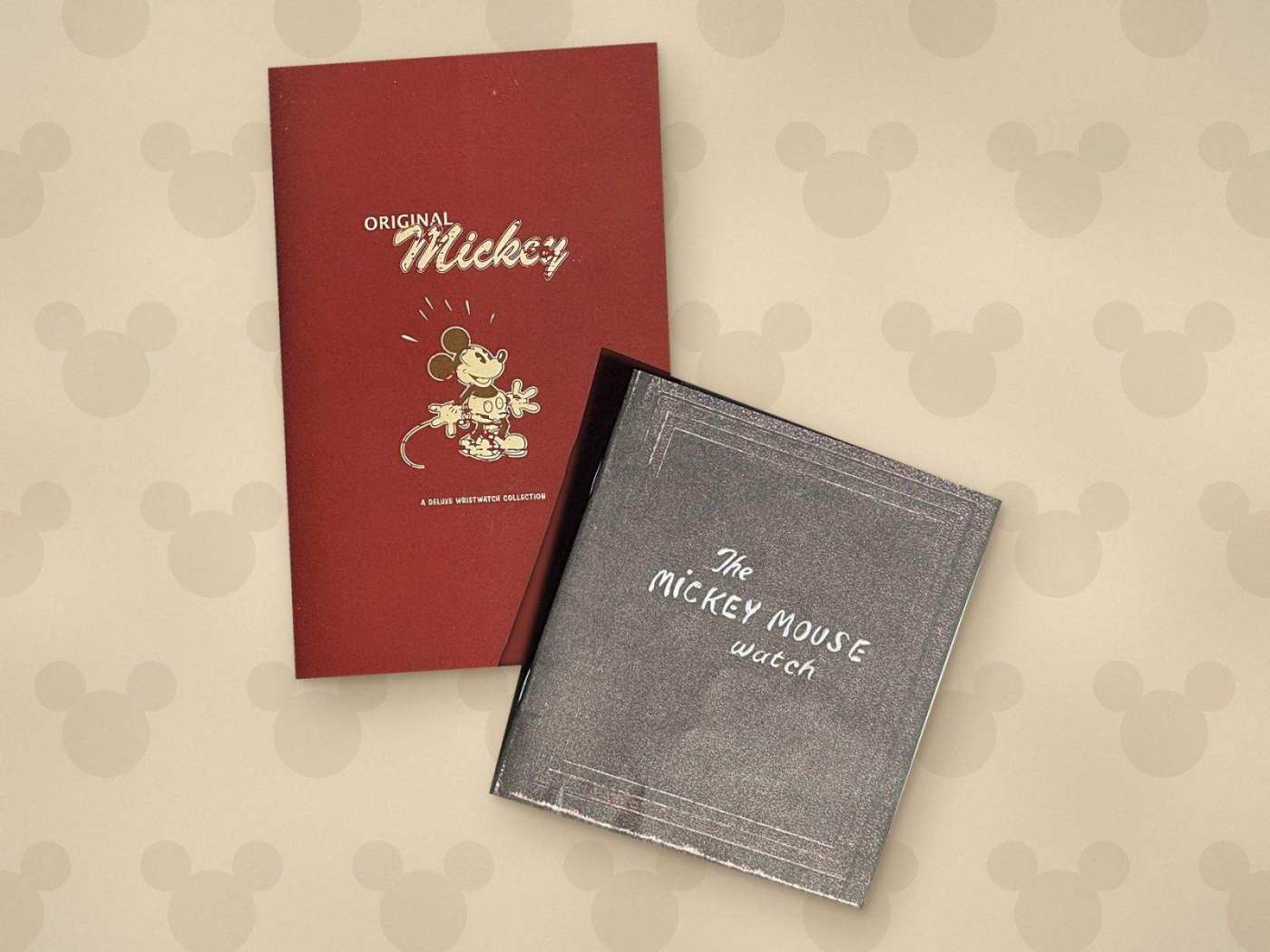 The Original Mickey red booklet and The Mickey Mouse Watch gray booklet from the Disney deluxe wristwatch collection