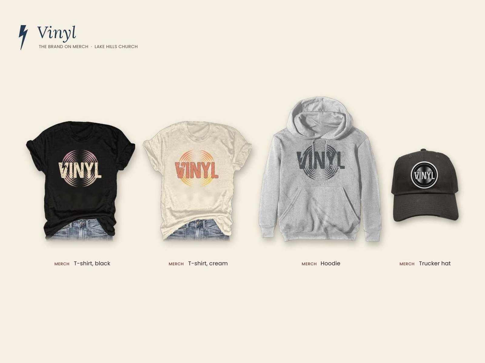 Lake Hills Church Vinyl campaign board, merchandise: the Vinyl logo on a black t-shirt, a cream t-shirt a gray hoodie and a trucker hat
