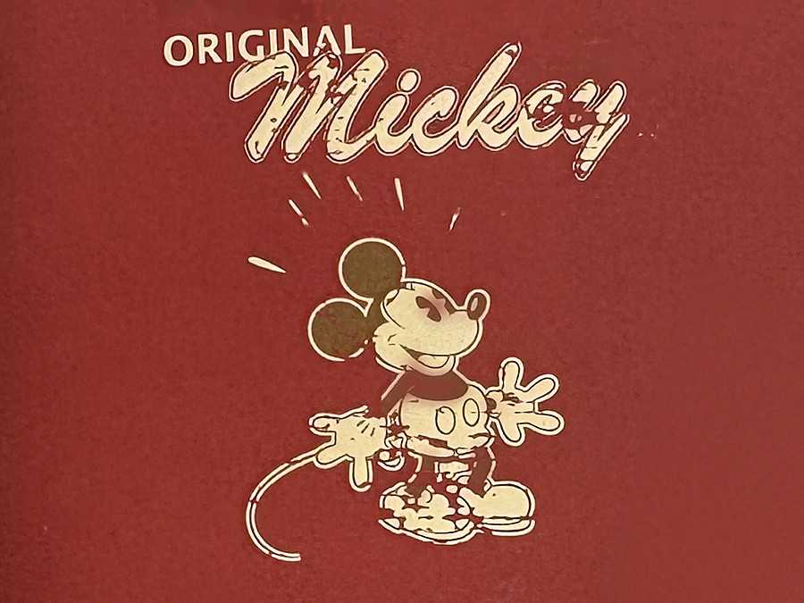 Close-up of the Original Mickey red booklet cover from the Disney watch collection
